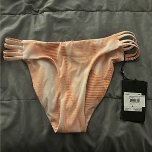Women's Hurley Quick dry, size small, low cut bottoms. Color- Pink/White
